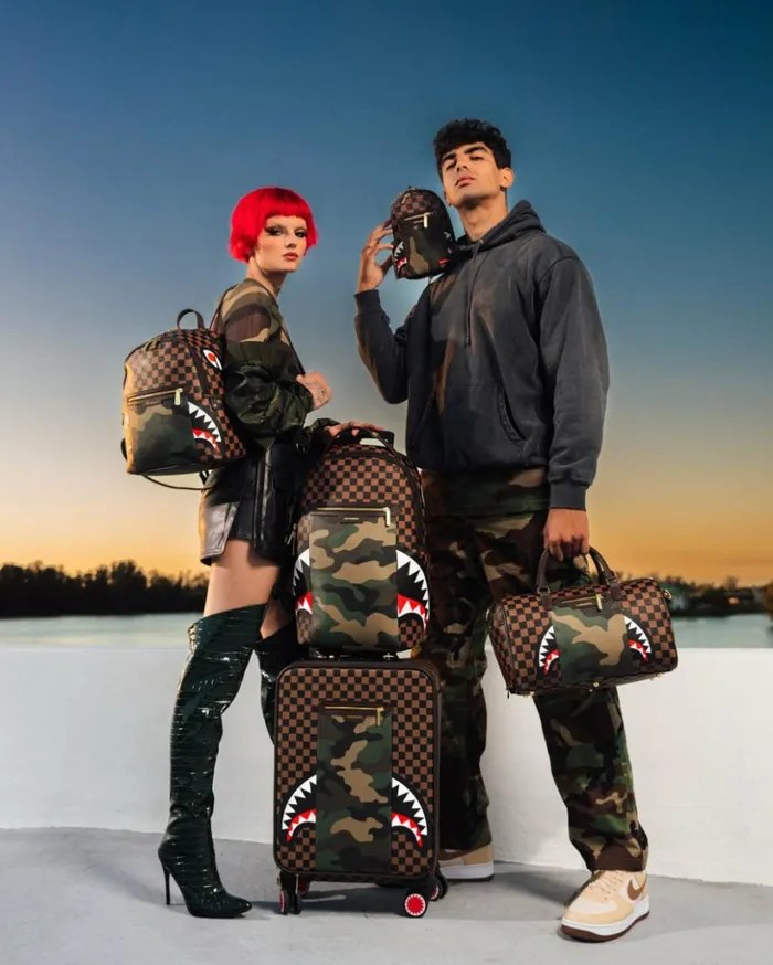 EXTERIOR GOLD ZIP POCKET SHARKS IN PARIS BACKPACK SLING Bags SPRAYGROUND